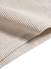 Tessuto a coste beige, morbido e piegato, ideale per abbigliamento e arredamento. Materiale di alta qualità, texture elegante e versatile.