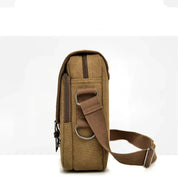 Borsa a tracolla in tela marrone, design compatto, con cerniera e tracolla regolabile. Ideale per uomo e donna, perfetta per uso quotidiano.
