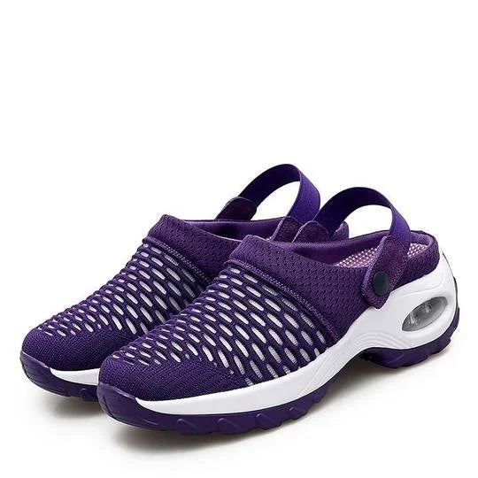 Scarpe da ginnastica viola unisex con design a rete traspirante, suola ammortizzata bianca e cinturino regolabile. Ideali per sport e tempo libero.