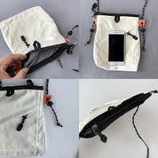 Borsa a tracolla bianca con cerniera, tasche multiple e cordino regolabile, ideale per smartphone e accessori. Design moderno e funzionale.