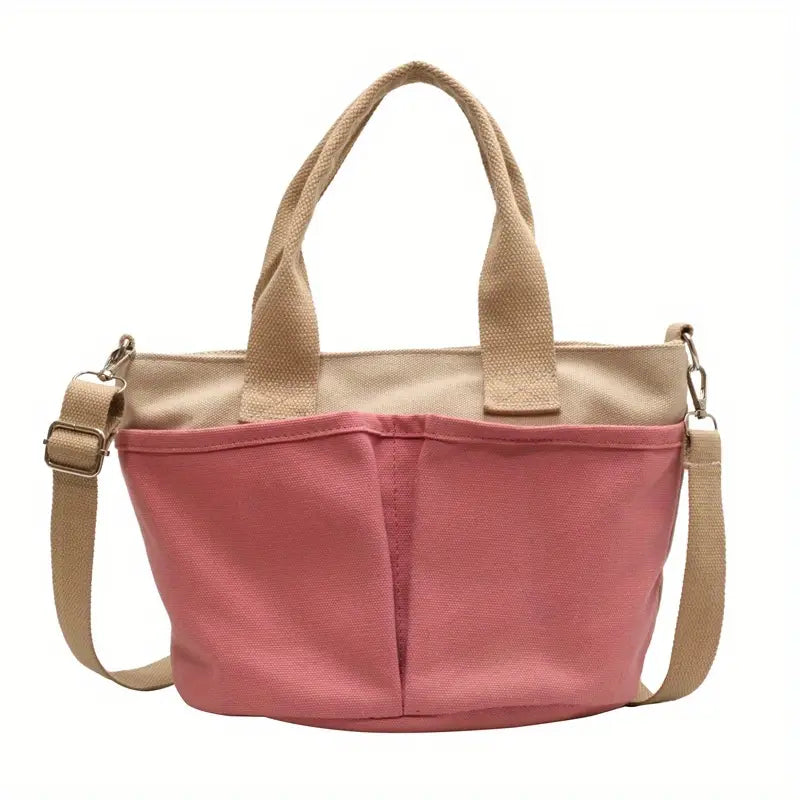Borsa a tracolla in tela rosa con manici beige, design casual e pratico, ideale per shopping e uso quotidiano. Accessorio moda donna.