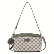 Borsa a tracolla donna in pelle verde e tessuto stampato, design elegante con pompon decorativo, ideale per moda casual e shopping.