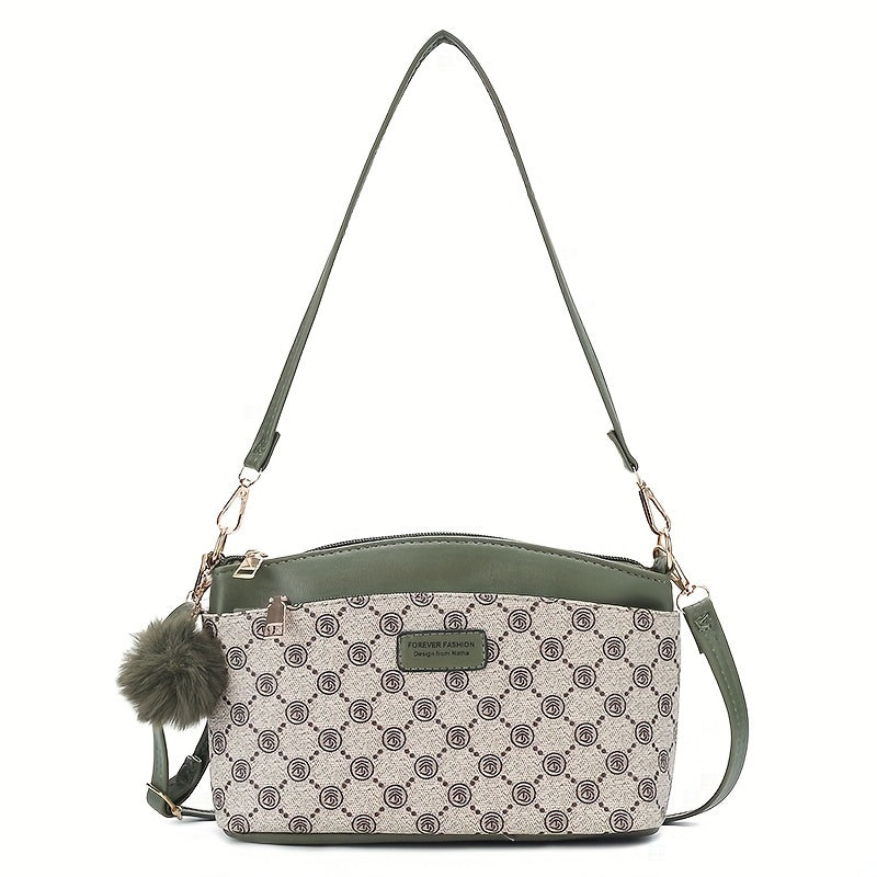 Borsa a tracolla donna in pelle verde e tessuto stampato, design elegante con pompon decorativo, ideale per moda casual e shopping.