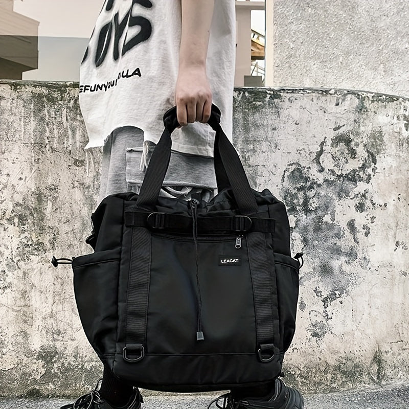 Borsa a tracolla nera unisex, design urbano, con tasche multiple e manici robusti. Ideale per viaggi e uso quotidiano. Stile casual e moderno.
