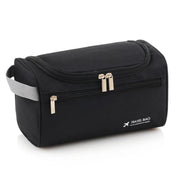 Borsa da viaggio nera con cerniera, manico grigio, tasca frontale, ideale per organizzare accessori da viaggio. Design compatto e funzionale.