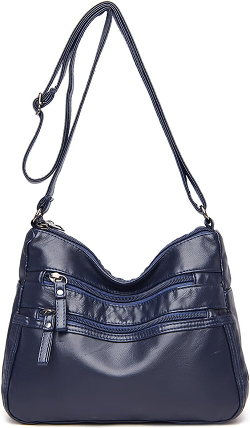 Borsa a tracolla in pelle blu scuro con cerniere multiple, design elegante e pratico, ideale per donna. Accessorio moda versatile e chic.