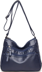 Borsa a tracolla in pelle blu scuro con cerniere multiple, design elegante e pratico, ideale per donna. Accessorio moda versatile e chic.