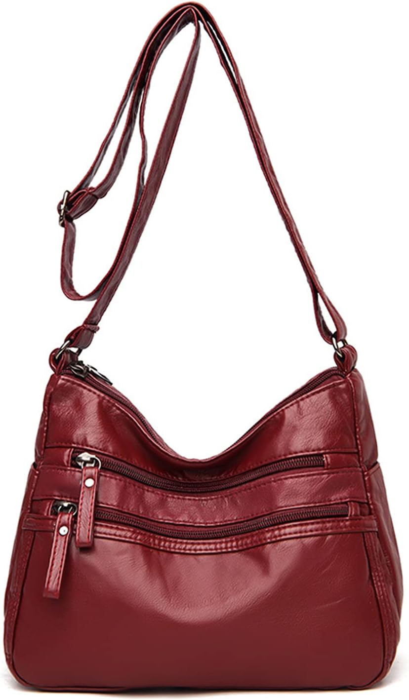 Borsa a tracolla in pelle rossa con cerniere multiple, design elegante e pratico, ideale per donna. Accessorio moda versatile e capiente.
