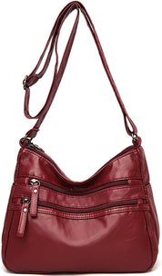 Borsa a tracolla in pelle rossa con cerniere multiple, design elegante e pratico, ideale per donna. Accessorio moda versatile e capiente.