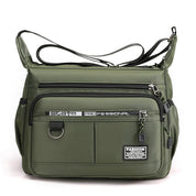 Borsa a tracolla verde militare unisex, design moderno, tasche multiple con cerniera, ideale per viaggi e uso quotidiano. Accessorio moda pratico.