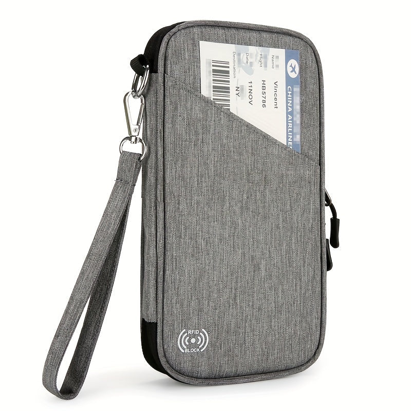 Custodia da viaggio grigia con cinturino, tasca esterna per biglietto aereo, chiusura zip, protezione RFID. Ideale per documenti e passaporto.