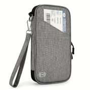 Custodia da viaggio grigia con cinturino, tasca esterna per biglietto aereo, chiusura zip, protezione RFID. Ideale per documenti e passaporto.