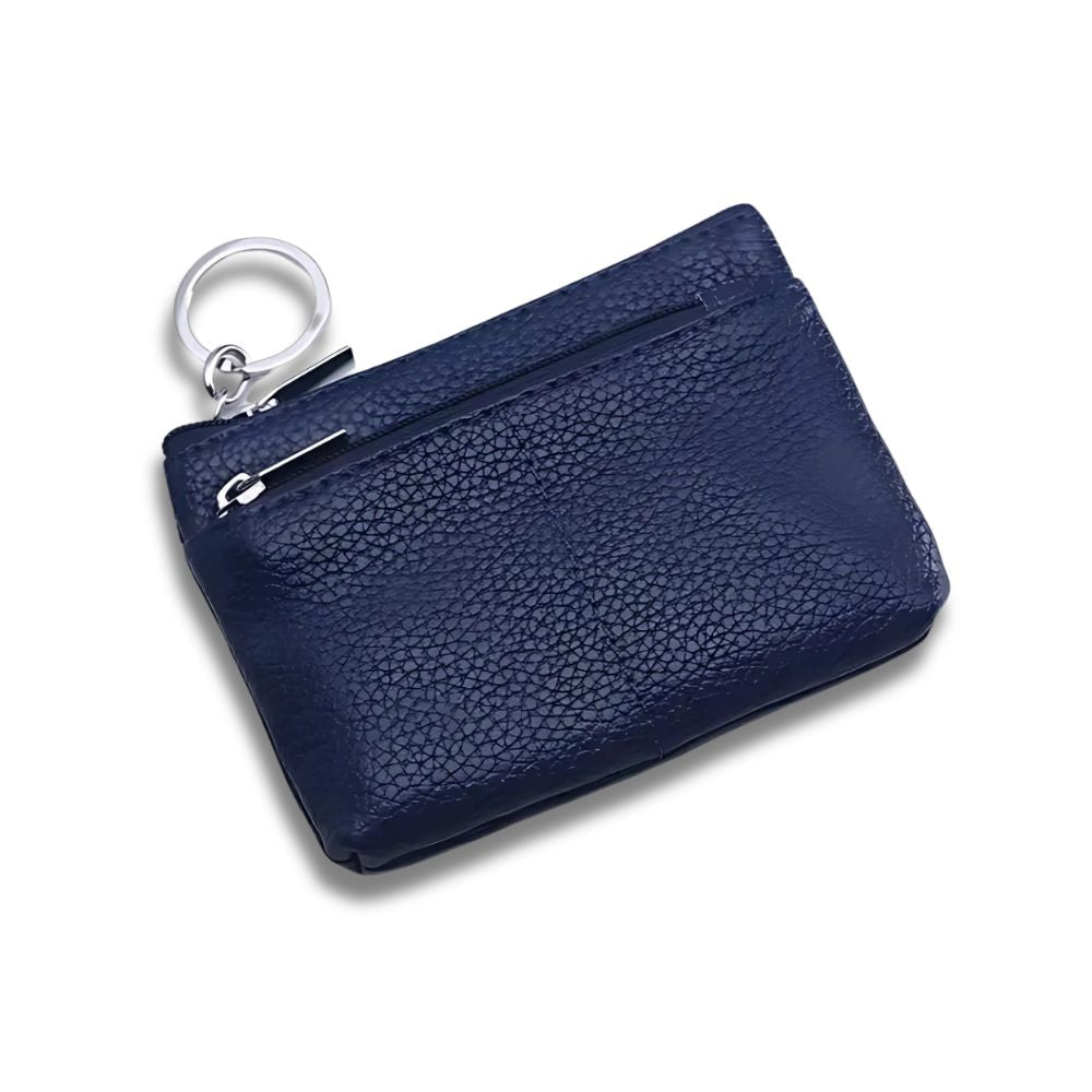 Portamonete in pelle blu scuro con anello portachiavi, design elegante e compatto, ideale per uomo e donna. Accessorio moda pratico e versatile.