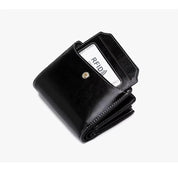 Portafoglio nero in pelle con protezione RFID, design compatto, tasca per carte di credito. Accessorio elegante e sicuro per uomo e donna.