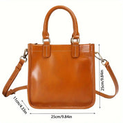 Borsa a mano in pelle marrone con tracolla regolabile, dimensioni 25x11x25 cm. Elegante e versatile, perfetta per ogni occasione.