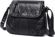 Borsa a tracolla in pelle nera, design elegante con cerniera frontale, ideale per moda donna. Accessorio versatile e di tendenza.