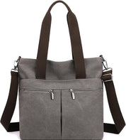 Borsa a tracolla in tela grigia con doppia cerniera, manici marroni e tracolla regolabile. Design casual, ideale per uso quotidiano.
