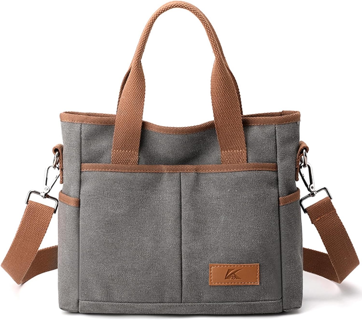 Borsa a tracolla in tela grigia con manici marroni, tasche esterne e tracolla regolabile. Design elegante e funzionale per uso quotidiano.