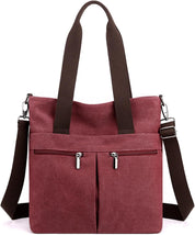 Borsa a tracolla in tela rosa con doppio manico marrone, tasche frontali con cerniera, design casual, ideale per shopping e uso quotidiano.