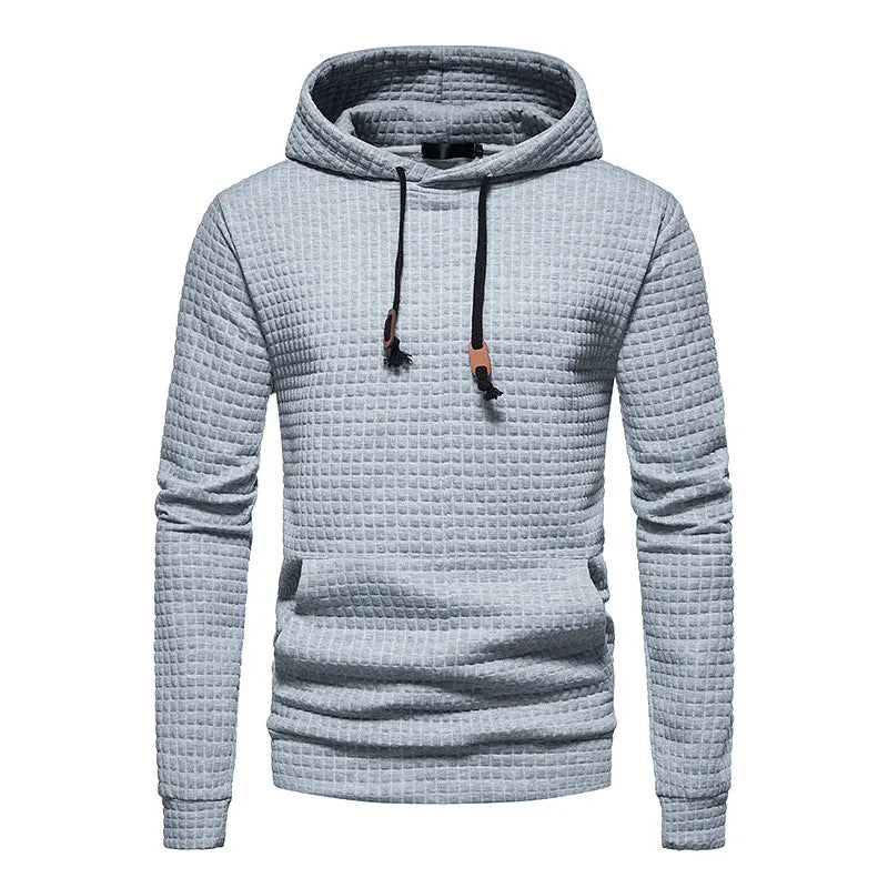 Felpa con cappuccio grigia a trama quadrettata, design casual, cordini regolabili, ideale per moda uomo autunno inverno.