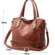Borsa a mano in pelle marrone con tracolla regolabile, dettagli in metallo dorato, dimensioni 34x16x26 cm, elegante e spaziosa per ogni occasione.