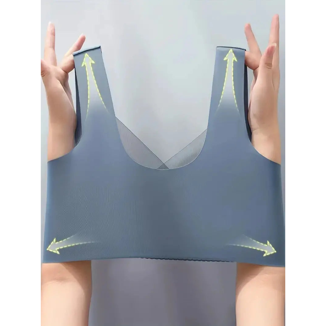 Reggiseno sportivo grigio senza cuciture, elasticizzato, con supporto, tenuto da mani. Ideale per fitness, yoga, comfort quotidiano.