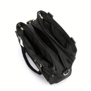 Borsa tote nera in pelle sintetica con doppio manico, tre scomparti con cerniera, design elegante e spazioso, ideale per lavoro e viaggio.