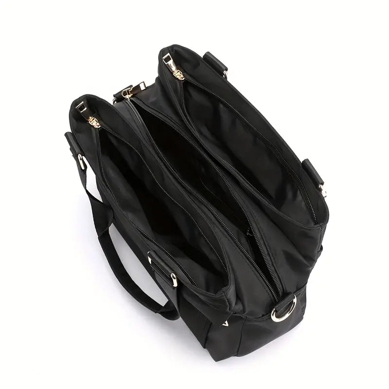Borsa tote nera in pelle sintetica con doppio manico, tre scomparti con cerniera, design elegante e spazioso, ideale per lavoro e viaggio.
