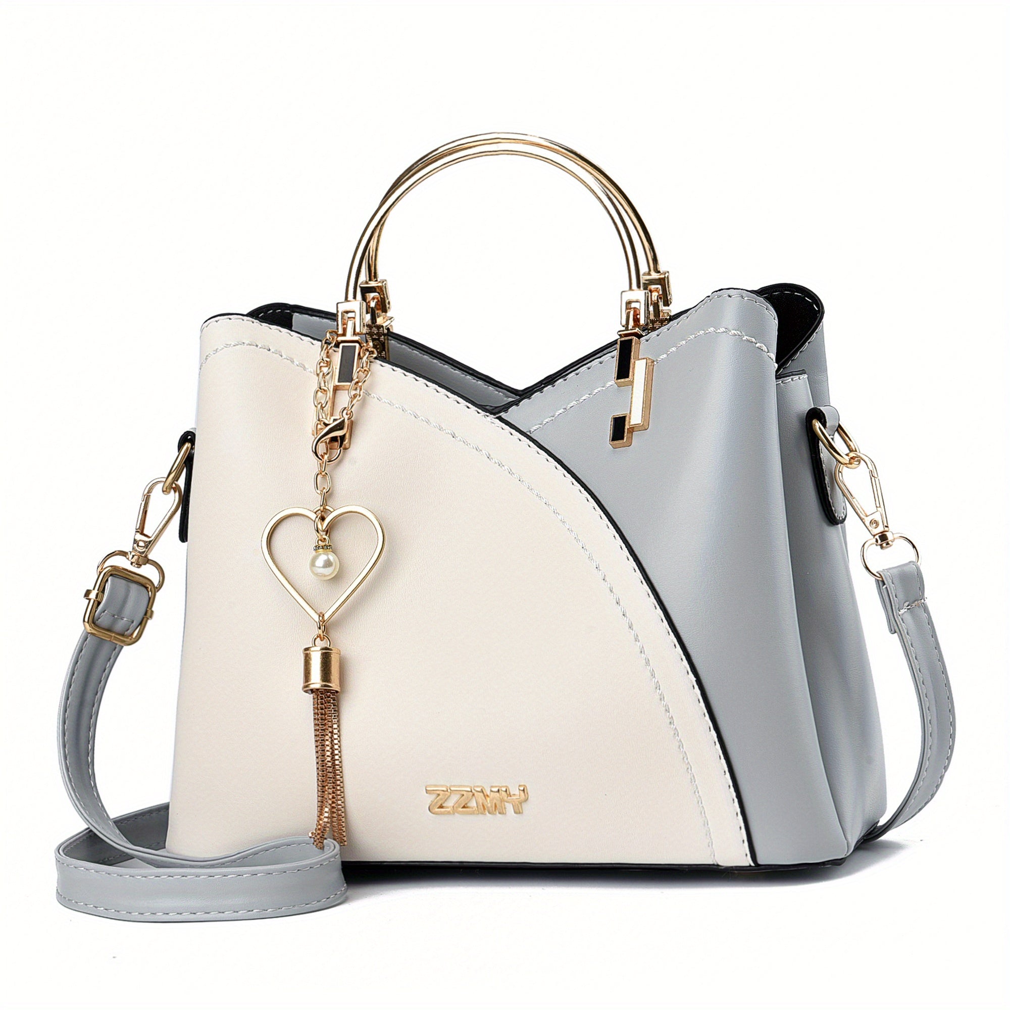 Borsa a tracolla donna in pelle bicolore bianco e grigio, con manico dorato e ciondolo a cuore. Elegante accessorio moda femminile.