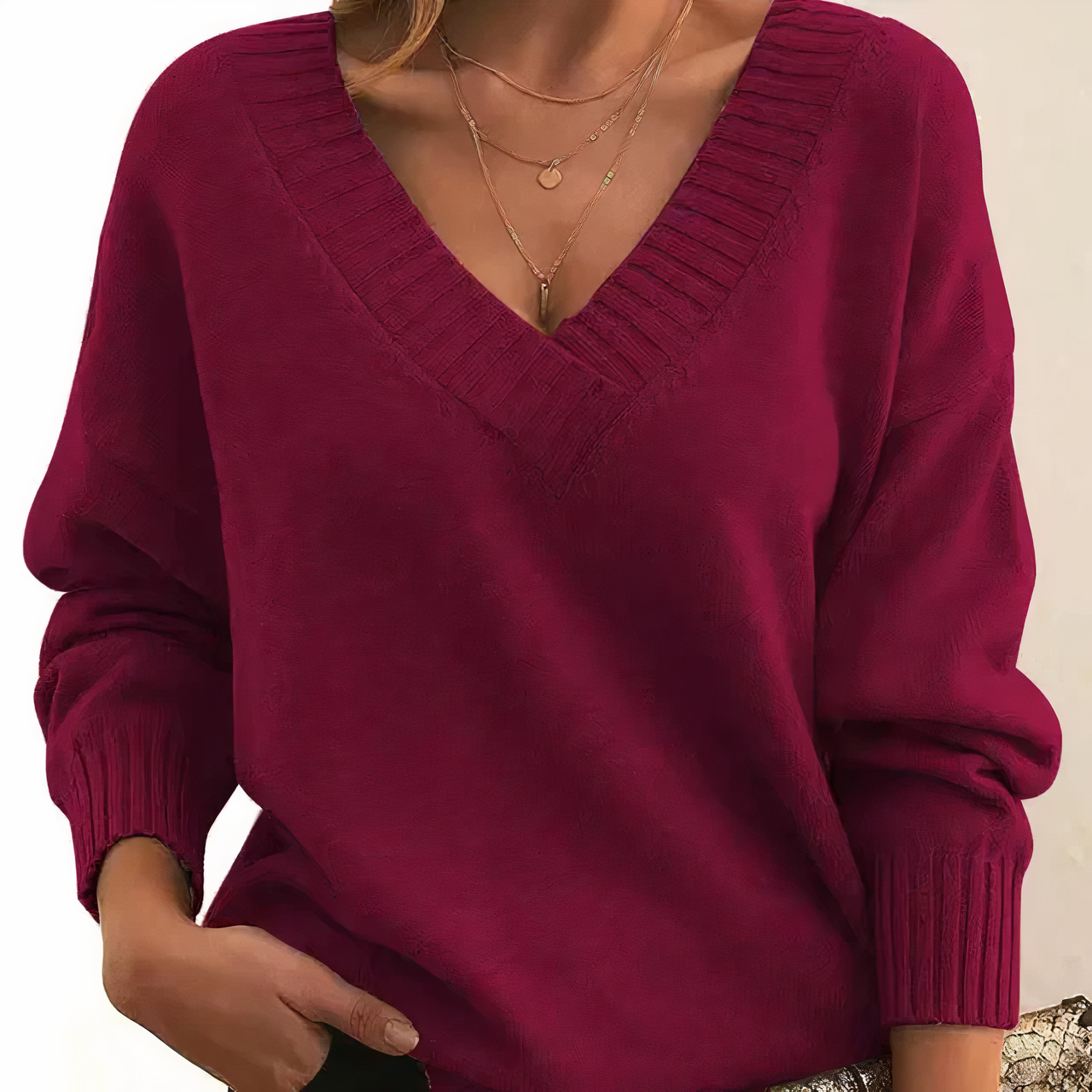 Maglione donna rosso bordeaux, scollo a V, maniche lunghe, tessuto morbido, stile casual elegante, perfetto per autunno inverno.
