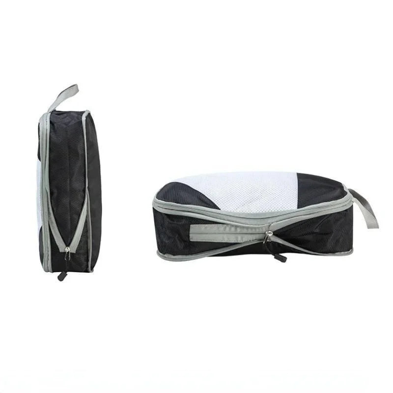 Cubo da viaggio nero con cerniera, design a rete, ideale per organizzare bagagli. Pratico e compatto, perfetto per valigie e zaini.