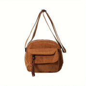 Borsa a tracolla in velluto a coste marrone, tasca frontale con chiusura a zip, design casual, ideale per moda donna e accessori autunno.