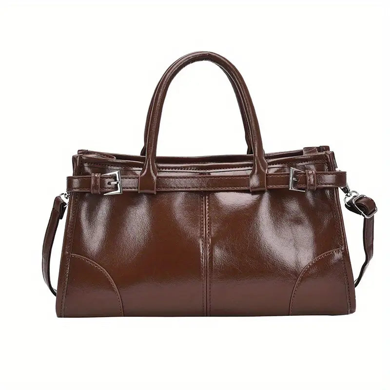 Borsa a mano in pelle marrone lucida, design elegante con manici e tracolla regolabile, ideale per moda donna e accessori di lusso.