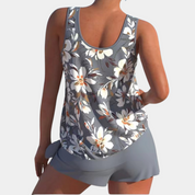 Top canotta donna floreale grigio, senza maniche, con pantaloncini abbinati. Moda estiva casual, abbigliamento donna, tessuto leggero e traspirante.