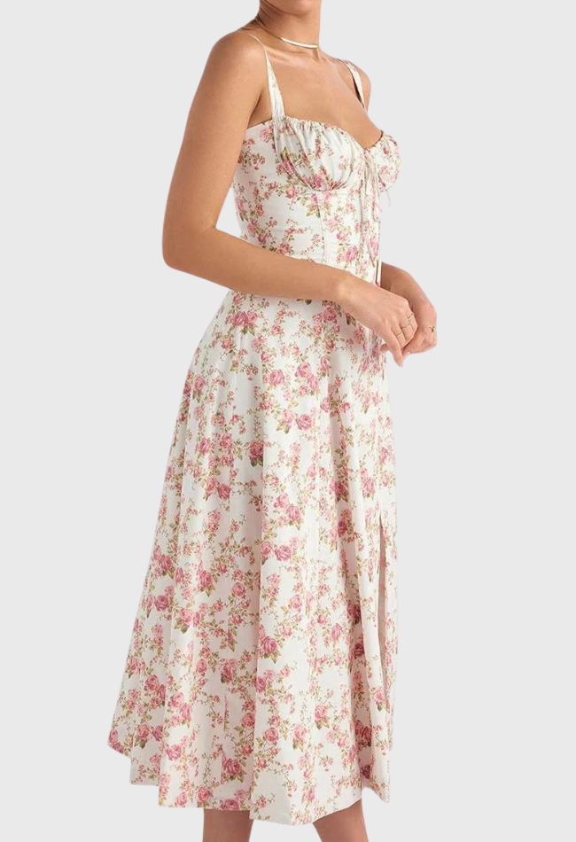 Abito estivo donna a fiori rosa, lunghezza midi, spalline sottili, scollo a cuore, stile vintage. Perfetto per occasioni casual e primaverili.