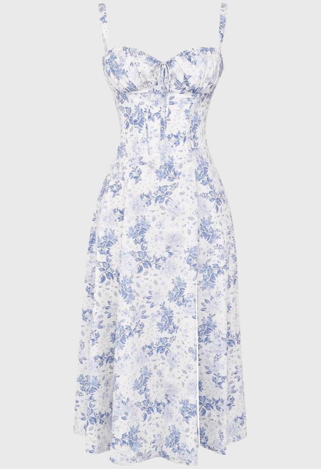 Abito estivo donna, stampa floreale blu su bianco, scollo a cuore, spalline sottili, lunghezza media. Elegante e femminile, perfetto per occasioni estive.
