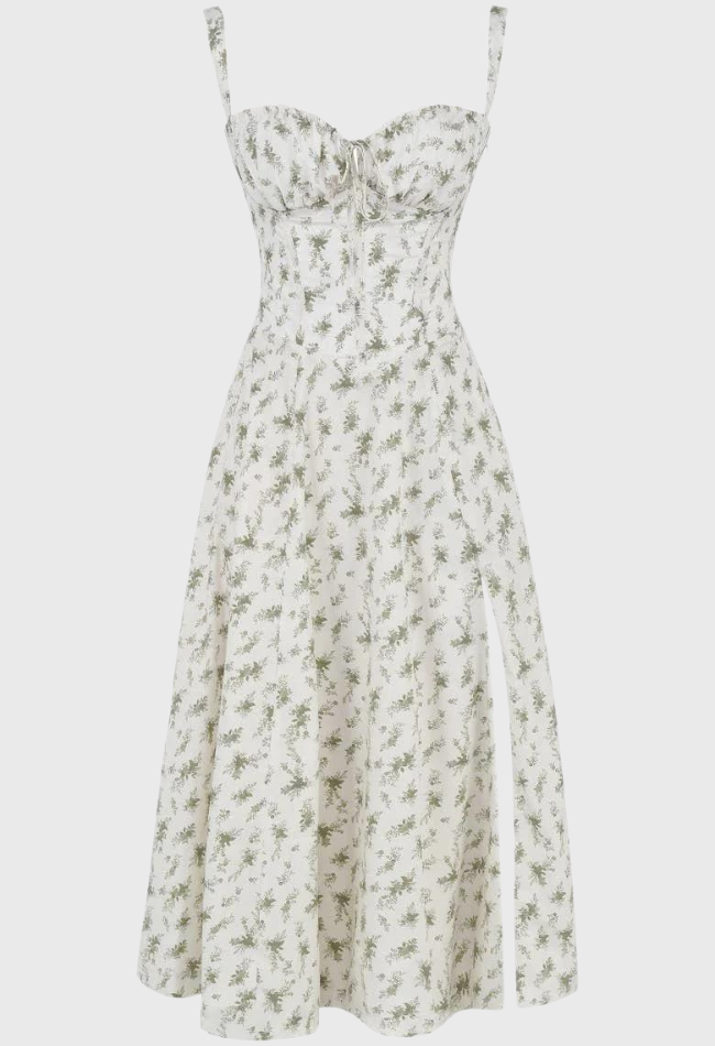 Abito estivo bianco a fiori verdi, senza maniche, con spalline sottili e spacco laterale. Vestito elegante donna, moda casual chic.