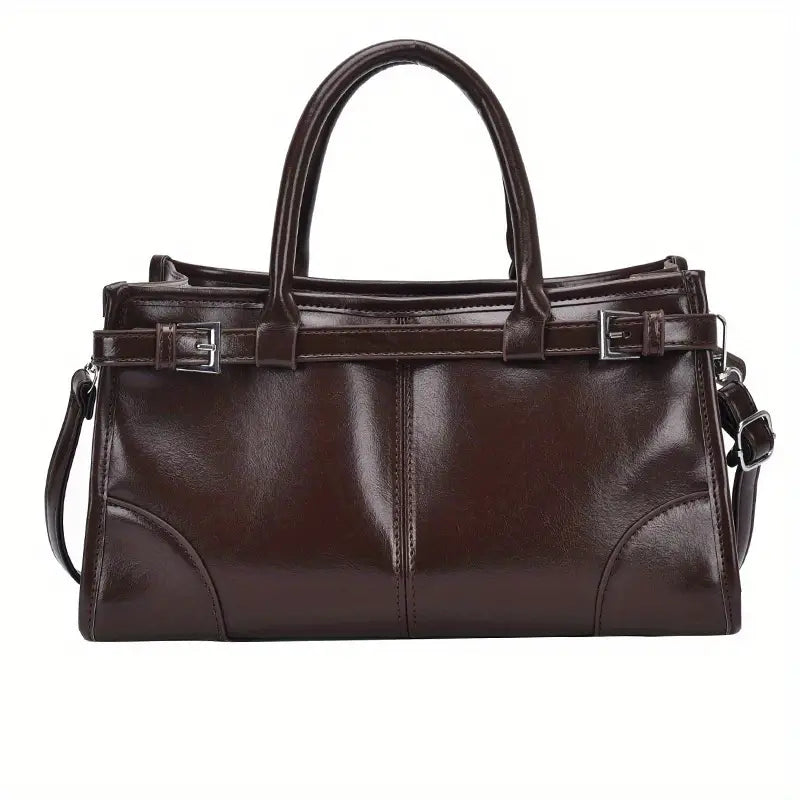 Borsa a mano in pelle marrone scuro, design elegante con doppio manico e tracolla regolabile, ideale per moda donna e accessori di lusso.