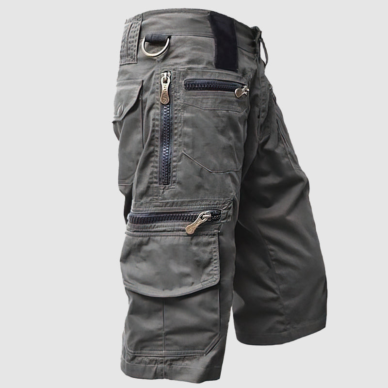 Pantaloncini cargo uomo grigi, multi-tasche, zip robuste, design casual, ideale per outdoor e attività sportive. Tessuto resistente e confortevole.