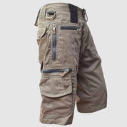 Pantaloncini cargo uomo marroni, multi-tasche con cerniere, stile casual, tessuto resistente, ideale per outdoor e attività sportive.