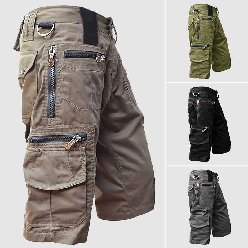 Pantaloncini cargo uomo multitasche, zip robuste, colori verde, nero, grigio. Design resistente, ideale per outdoor e attività sportive.