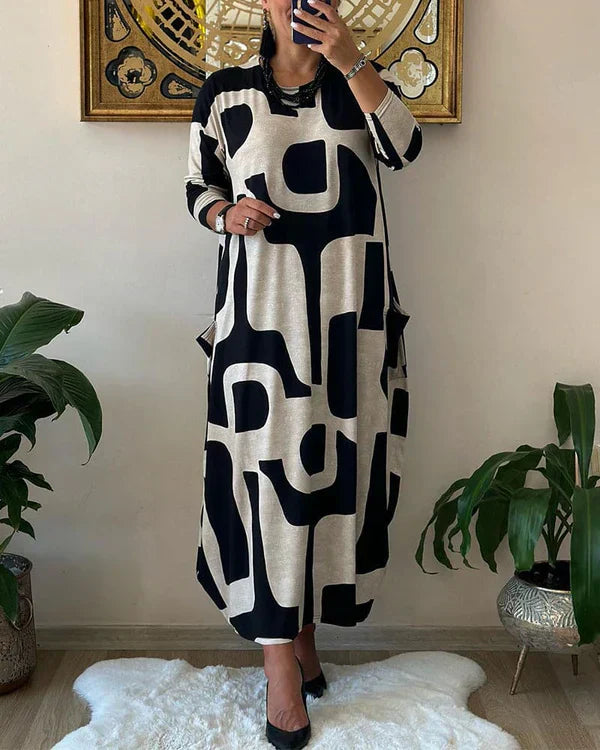 Abito lungo donna con stampa geometrica bianco e nero, maniche lunghe, tasche laterali. Moda casual elegante, perfetto per l'autunno.