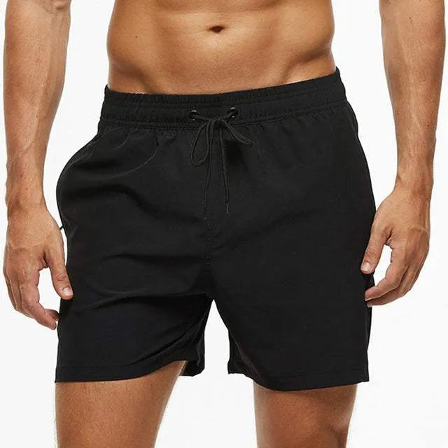 Pantaloncini da uomo neri, elasticizzati in vita con laccio, ideali per sport e tempo libero. Design semplice e versatile.