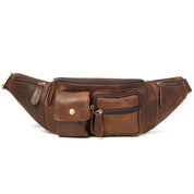 Marsupio in pelle marrone vintage con multiple tasche e cerniere, ideale per viaggi e uso quotidiano. Accessorio moda pratico e resistente.