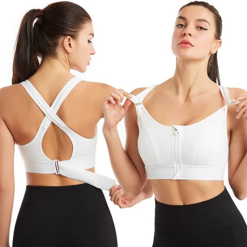 Due donne indossano reggiseni sportivi bianchi con chiusura frontale e schiena incrociata, ideali per fitness e yoga. Design comodo e traspirante.