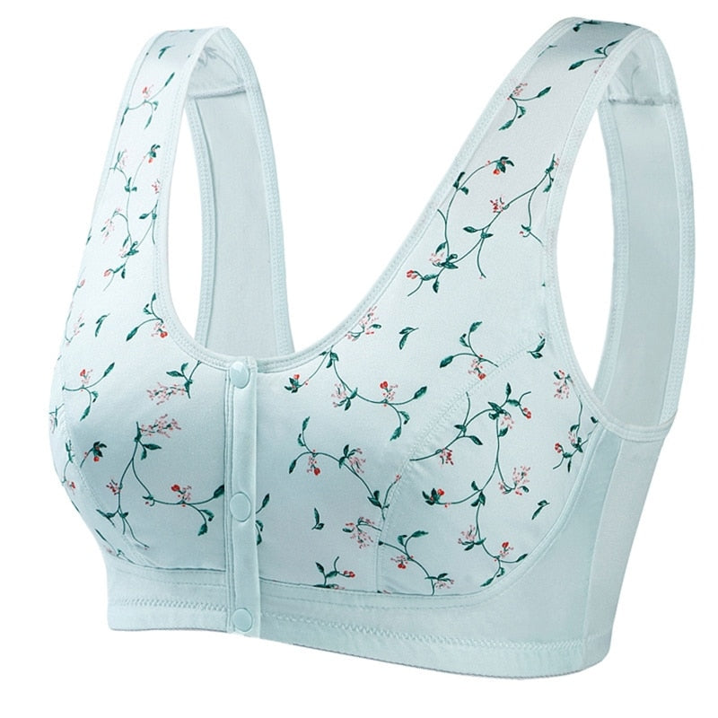 Reggiseno sportivo bianco con stampa floreale, chiusura frontale a bottoni, design senza ferretto, comodo e traspirante per attività sportive.
