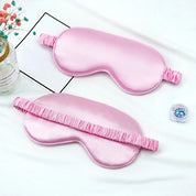 Mascherina per dormire in seta rosa, elegante e morbida, ideale per un sonno riposante. Accessorio notte, comfort, relax.