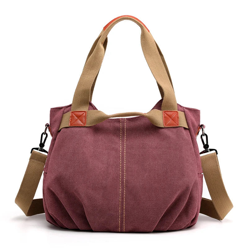 Borsa a tracolla in tela rosa con manici beige, design casual, chiusura a zip, ideale per donna, moda quotidiana, resistente e spaziosa.