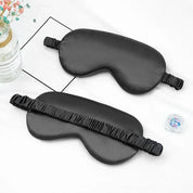 Maschera per dormire in seta nera, design ergonomico, elastico regolabile, ideale per relax e viaggio. Accessorio per il sonno confortevole.