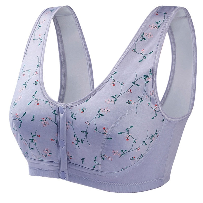 Reggiseno sportivo viola con chiusura frontale, decorato con motivi floreali. Design senza ferretto, comfort e supporto per attività sportive.